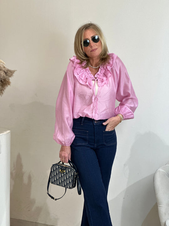 Blouse col volant rose